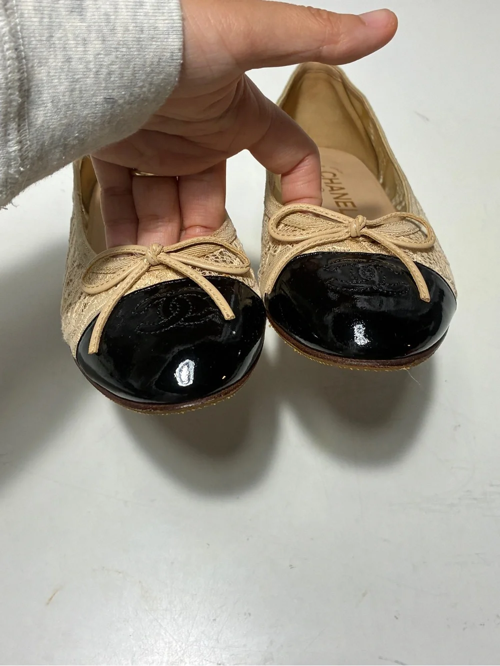 CHANEL Beige Lace Ballet Flats with Black Patent Cap Toe and Bow